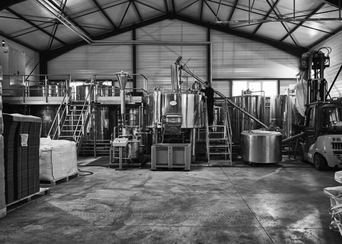 brewing-2 Production tanks and processing equipment inside the Rozelieures facility, where raw materials are handled and prepared for French single malt whisky making.